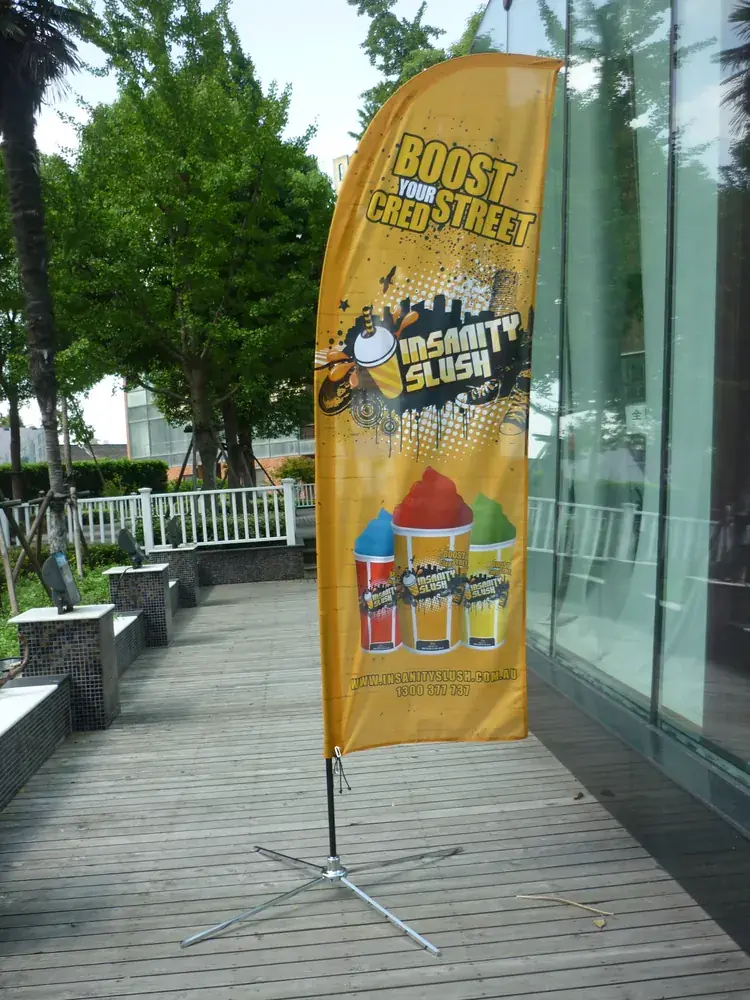 Wolflag factory-direct custom feather flag for Insanity Slush, a printed outdoor advertising banner with cross base for business promotions.