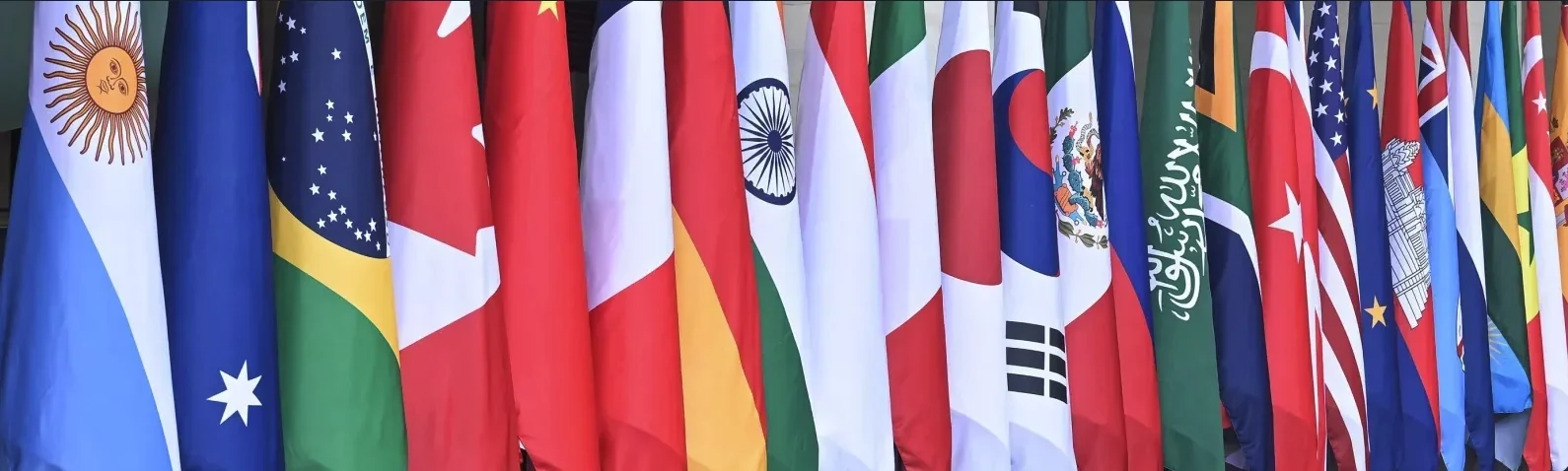 Close-up of international national flags including Argentina, Brazil, Canada, China and USA